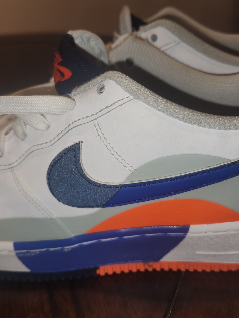 USED Nike Kids' White Leather Sneakers with Blue & Orange Accents